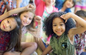 Small children smiling during class